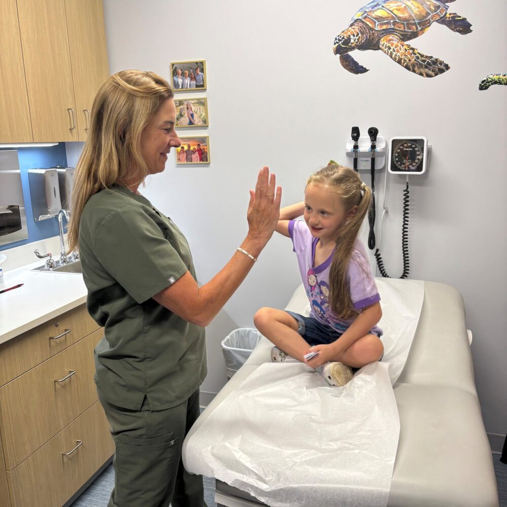 Woburn and North Andover Pediatrics - demri and dr burba high five